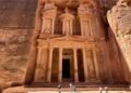 The Treasury in Petra, Jordan, carved into reddish sandstone cliffs, a symbol of Nabatean architecture and geological marvel—featured in the Petra science travel guide.