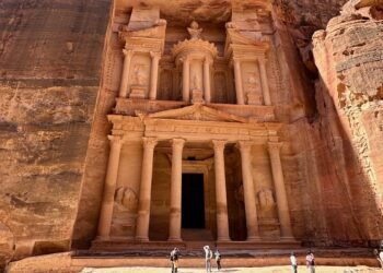 The Treasury in Petra, Jordan, carved into reddish sandstone cliffs, a symbol of Nabatean architecture and geological marvel—featured in the Petra science travel guide.
