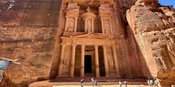 The Treasury in Petra, Jordan, carved into reddish sandstone cliffs, a symbol of Nabatean architecture and geological marvel—featured in the Petra science travel guide.