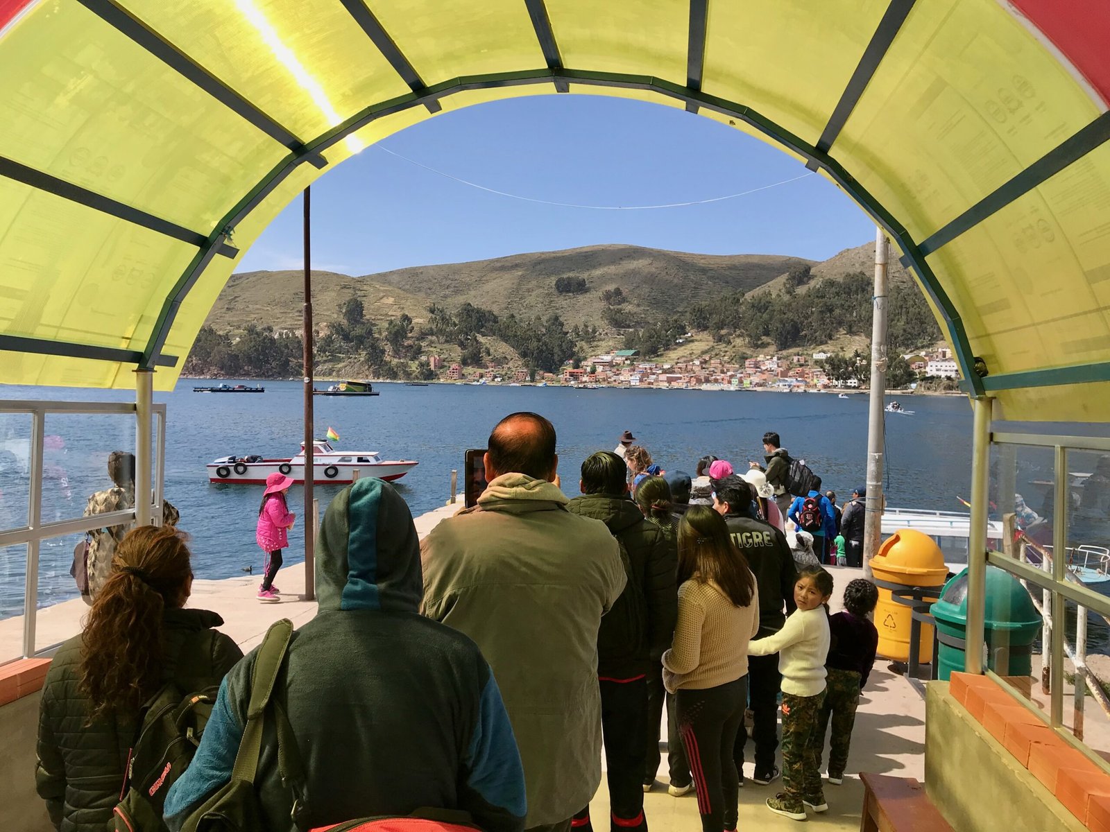 People lined up to board a boat for a ferry crossing at San Pablo de Tiquina on Lake Titicaca.