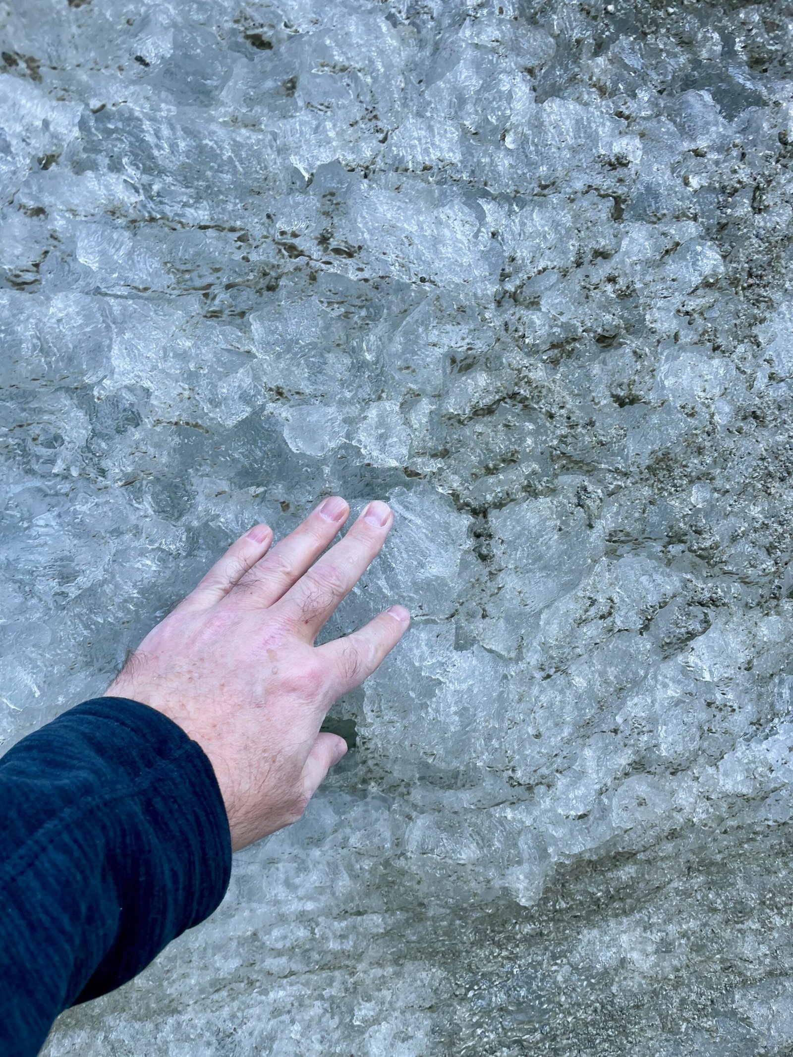 Curious Don author Don Trynor touching the Mer de Glace glacier for the first time near Chamonix, France.