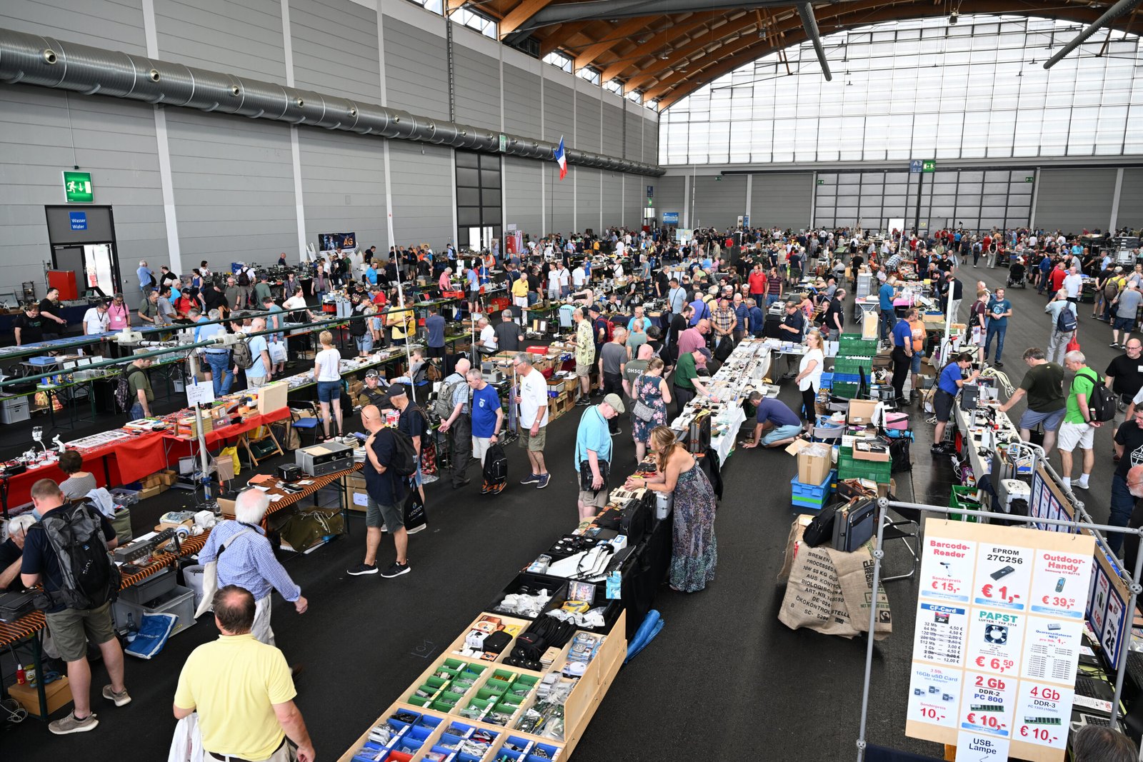 View of the Friedrichshafen Ham Radio Fair event floor, with vendors showcasing products and participants exploring exhibits. Photo: Messe Friedrichshafen.