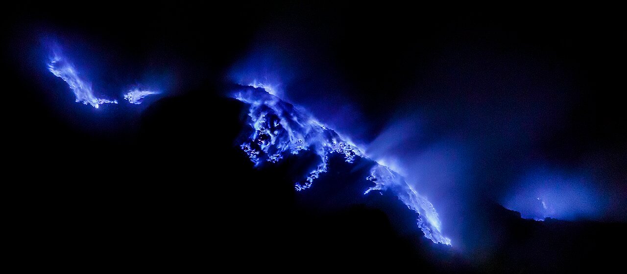 Blue fire glowing in the Kawah Ijen volcanic crater at night, East Java, Indonesia. Photo by Thomas Fuhrmann.