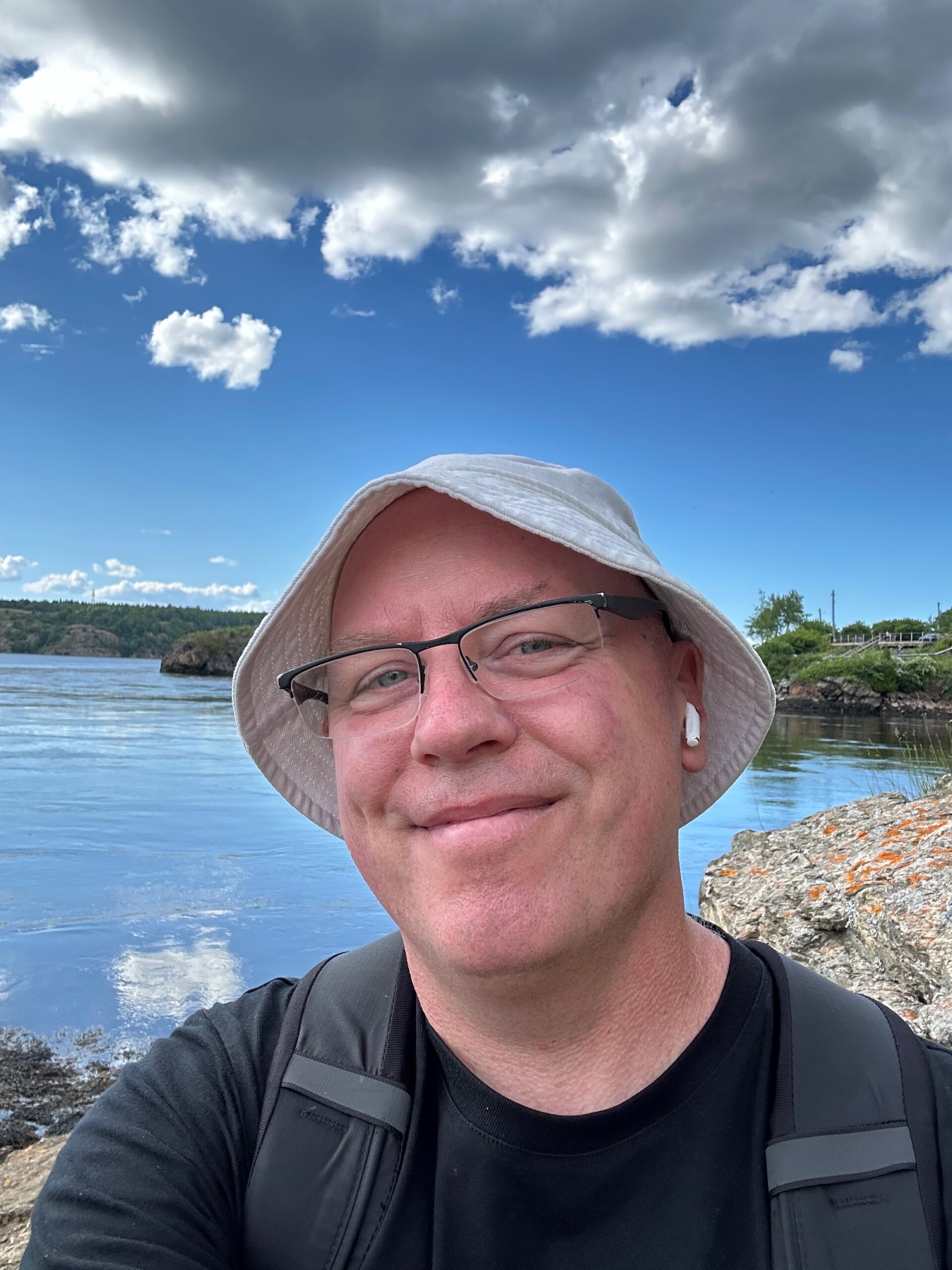 Don Trynor standing on a rocky ledge, observing the Saint John River’s reversal at the Reversing Falls in Saint John, New Brunswick.