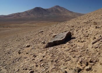 The Atacama Desert, one of the top places that look like Mars, showing rocky red terrain and distant mountains—used by NASA for Mars rover testing.