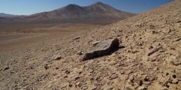 The Atacama Desert, one of the top places that look like Mars, showing rocky red terrain and distant mountains—used by NASA for Mars rover testing.