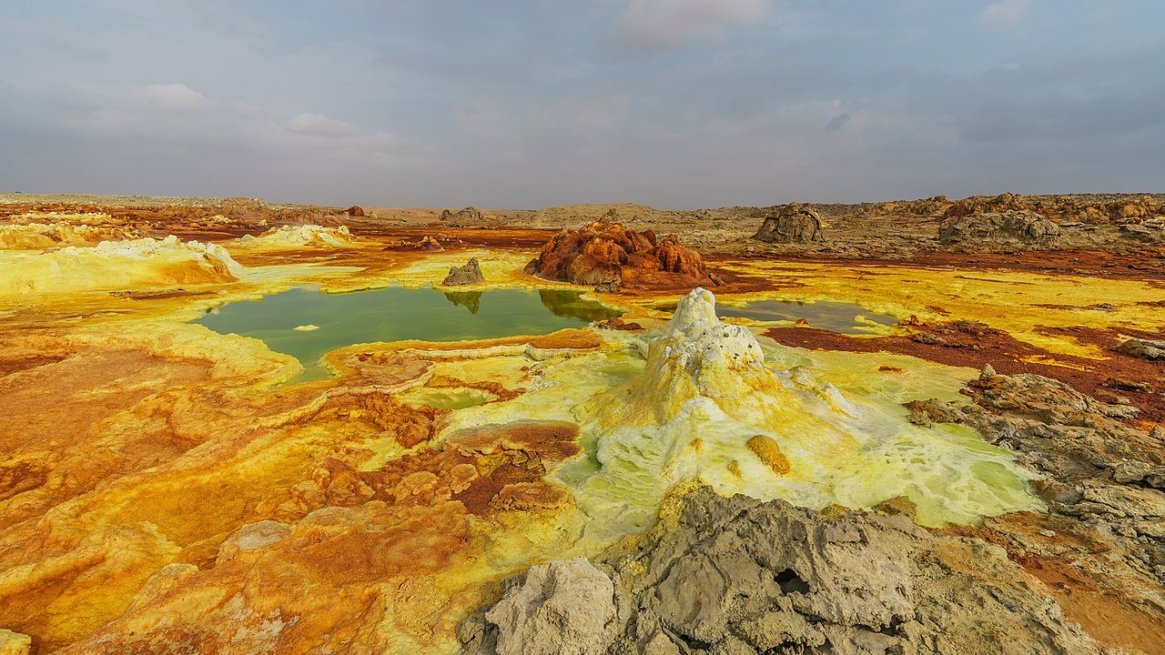 Colorful hydrothermal spring in Dallol, Ethiopia, with mineral deposits and sulfur pools—one of the most extreme places that look like Mars.