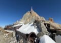 Aiguille du Midi summit station seen from the Mont Blanc side, with a snow-covered tubular passage leading toward the observation decks.