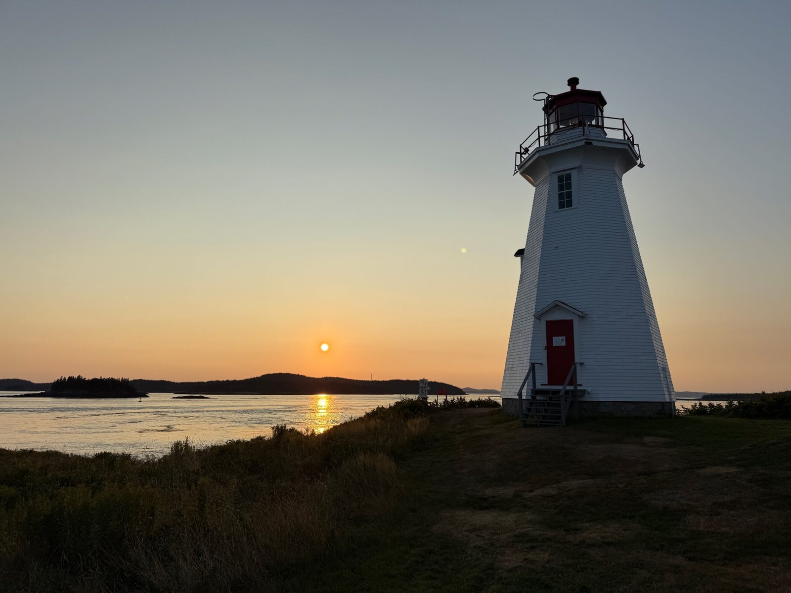 Green’s Point Lighthouse at sunset on the Bay of Fundy near Letete, New Brunswick.