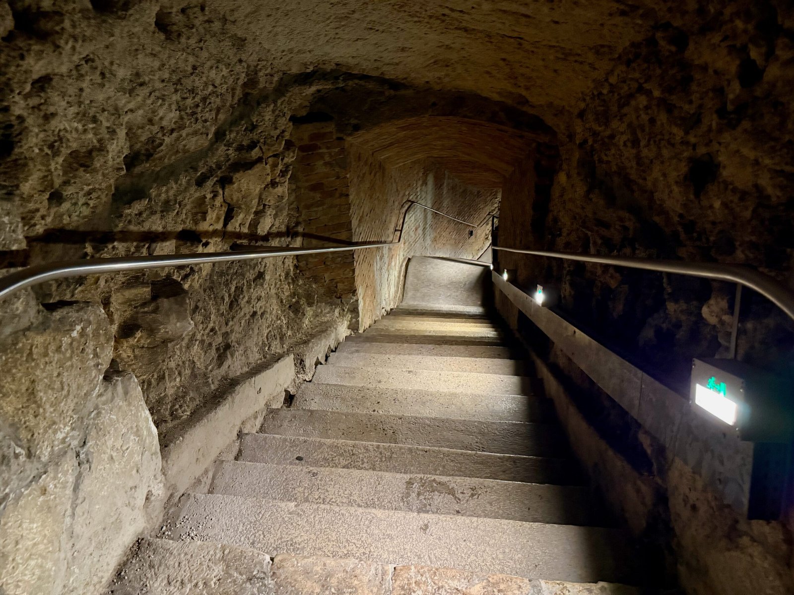 Staircase leading down into the Tapolca Lake Cave, where visitors reach the underground river flowing beneath the town.