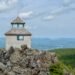 Wooden fire tower at the summit of Mount Carleton with Nictau Lake and Appalachian Mountains in the distance, Mount Carleton Provincial Park, New Brunswick.