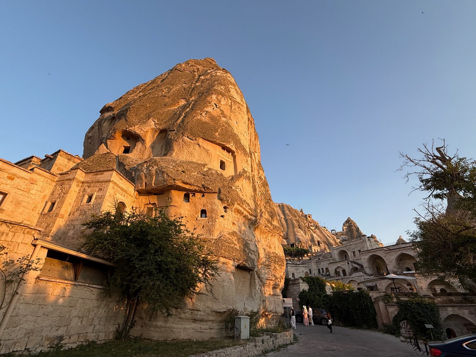 Cave hotels and homes carved into the rock formations in Göreme, Türkiye, the town at the heart of the Cappadocia hot air balloon experience.